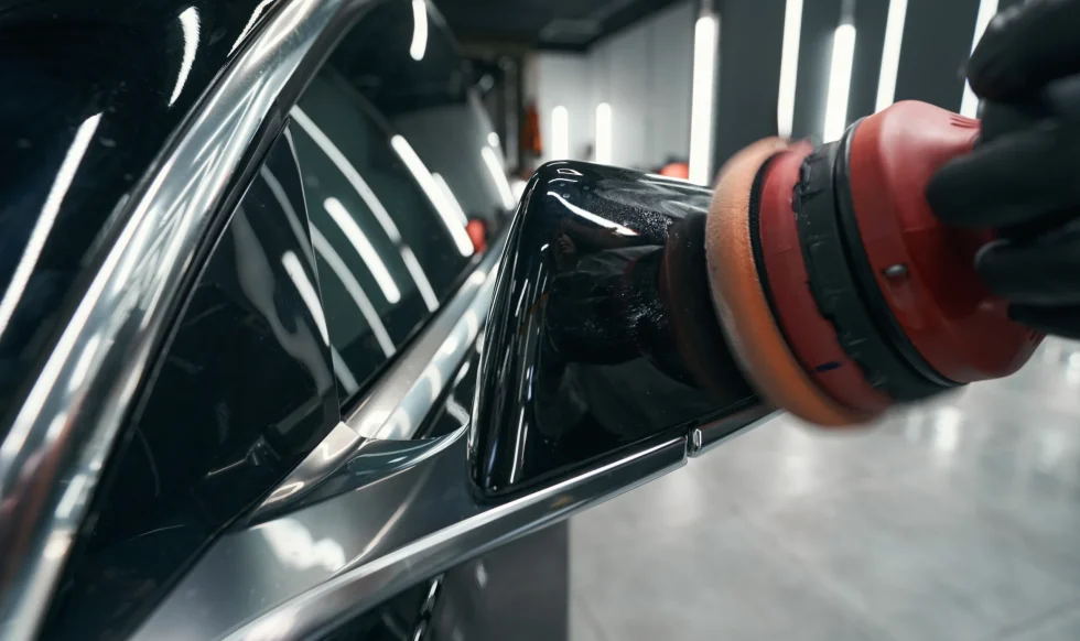 gloved-hand-buffing-exterior-of-car-with-polisher-2025-03-05-04-56-31-utc gloved-hand-buffing-exterior-of-car-with-polisher-2025-03-05-04-56-31-utc